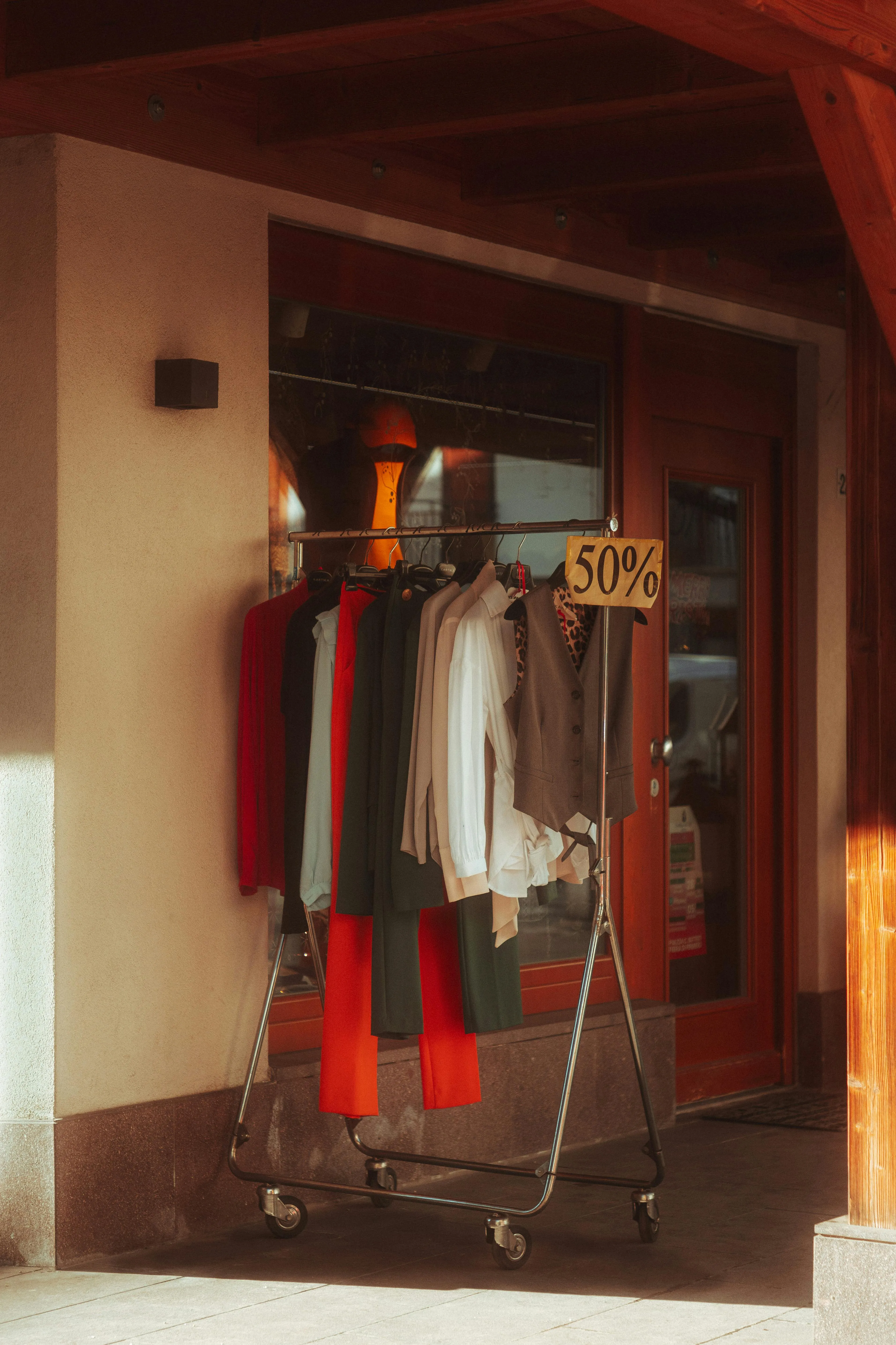 A rack of unwanted jackets discounted at half price